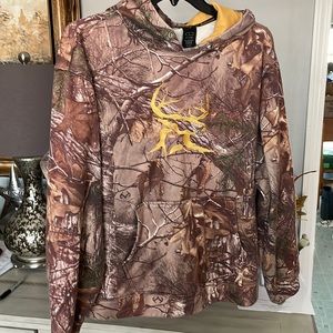 Bushmaster size large hundred percent polyester hoodie camouflage with gold deer